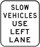 white sign with black text, slow vehicles use left lane