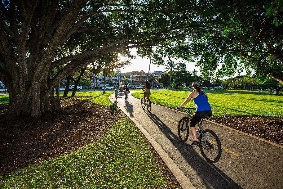 Bicycle riders riding on a bike path.