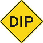 yellow diamond-shaped sign with the word dip in black