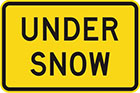 yellow sign with black text, under snow