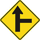 yellow diamond-shaped sign with straight black arrow with a straight branch leaving it at a right angle on the right