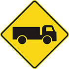 yellow diamond-shaped sign with black truck icon