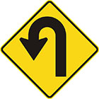 yellow diamond-shaped sign with black arrow that turns left into a u-shape