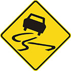 yellow diamond-shaped sign with black car icon and skid marks indicating swerving movement