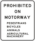 white sign with black text, prohibited on motorway, pedestrians, bicycles, animals, agricultural machinery