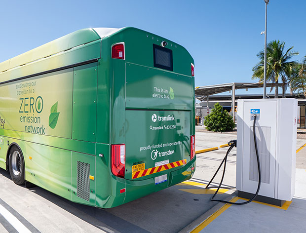 Bus next to a electric charging station