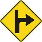 yellow diamond-shaped sign with black arrow that curves sharply right with a thinner line continuing upward