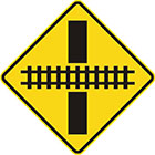 yellow diamond-shaped sign with black line and rail tracks showing what angle they intersect the road