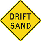 yellow diamond-shaped sign with black text, drift sand