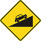 yellow diamond-shaped sign with black car facing up a slope