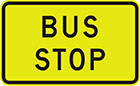 yellow sign with black text, bus stop