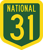 Green shield-shaped sign with yellow text, national 31