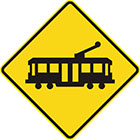 yellow diamond-shaped sign with black tram icon