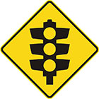 yellow diamond-shaped sign with black traffic lights icon