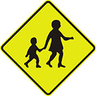 yellow diamond-shaped sign with a black symbol of an older child holding a child's hand