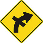 yellow diamond-shaped sign with black arrow that curves steadily right with a straight line crossing the tail in the middle