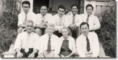 Clem\'s mother and father with Malaysian students who he was teaching surveying subjects