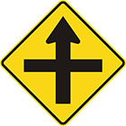 yellow diamond-shaped sign with straight black arrow with another straight line crossing it at right angles