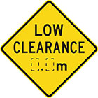 yellow diamond-shaped sign with black text, low clearance, and space for measurement