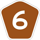 brown pentagonal sign with the number 6