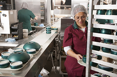 Woman preparing food on trolley