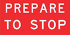 red sign with white text, prepare to stop