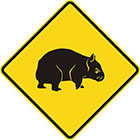 yellow diamond-shaped sign with black wombat icon