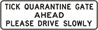 white sign with black text, tick quarantine gate ahead, please drive slowly