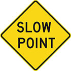 yellow diamond-shaped sign with black text, slow point