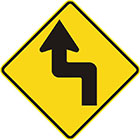 yellow diamond-shaped sign with black arrow that has tail bent at right angles left then right