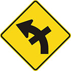 yellow diamond-shaped sign with black arrow that curves steadily left with a straight line crossing the tail in the middle