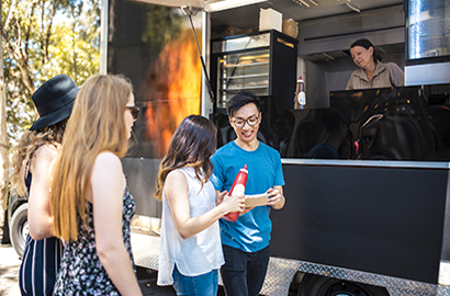 Youth ordering food from a food truck