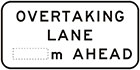 white sign with black text, overtaking lane, space for distance, ahead