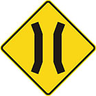 yellow diamond-shaped sign with 2 parallel black lines that veer toward each other slightly and then away again