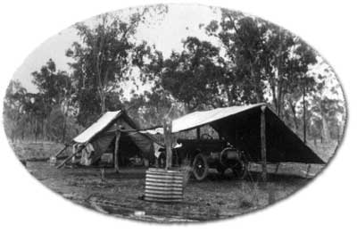 Surveyor H Leahy\'s survey camp next to a bore drain.