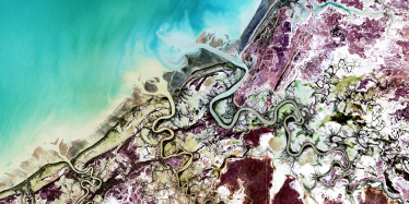 This image shows the Norman, Bynoe, and Flinders Rivers (from north to south) flowing into the Gulf of Carpentaria, at low tide.