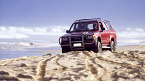 4 wheel-drive vehicle on the beach.