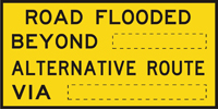 Image of a sign showing that the road ahead is flooded and what the alternative route is