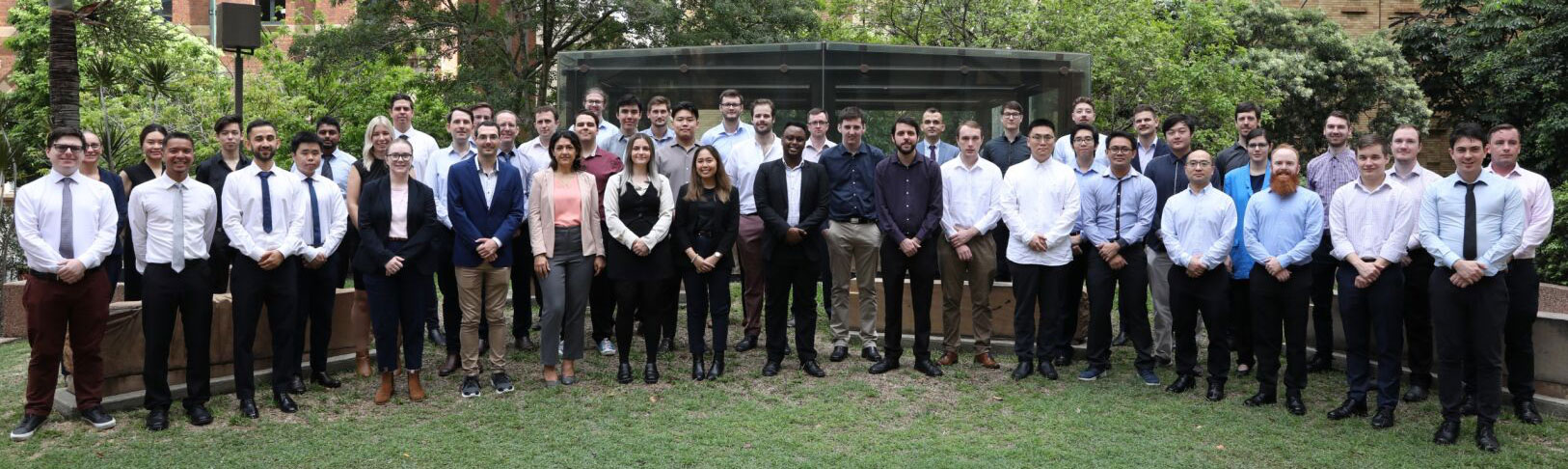 Group of people standing looking at the camera