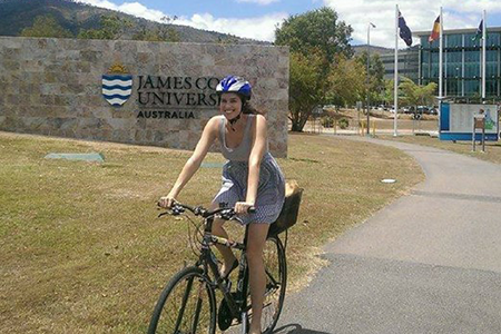 A person commuting on a bicycle.