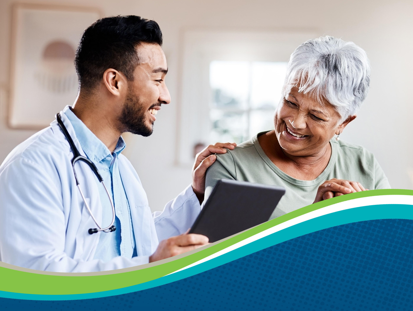 A medical professional with his arm on a patient's shoulder holding a clipboard which the patient is looking at smiling.