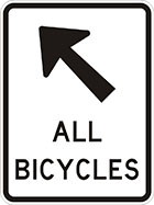 white sign with black arrow and the words all bicycles