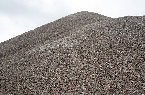 a pile of loose gravel under blue sky