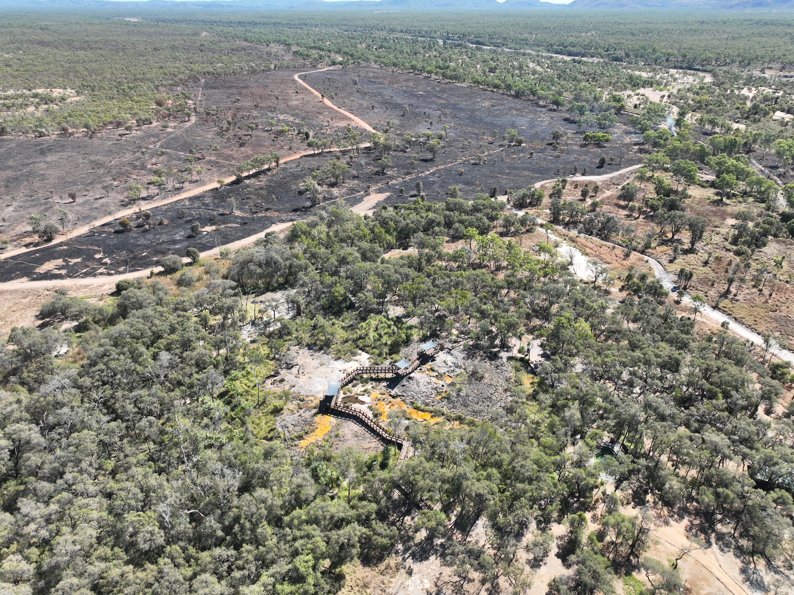 Aerial view over country showing burn scar